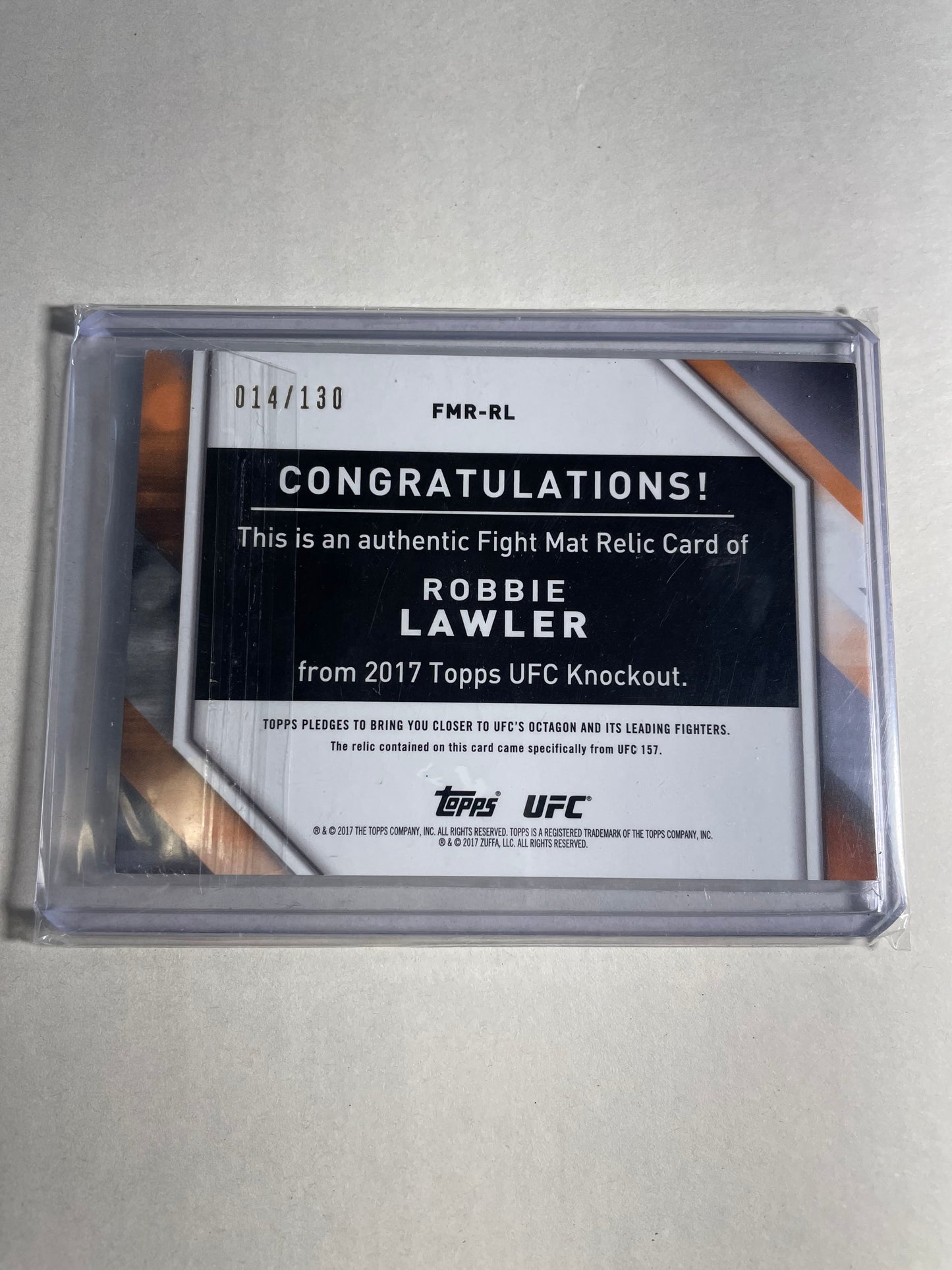 2017 Topps UFC Knockout Fight Mat Relic Card featuring former UFC Welterweight Champion Robbie Lawler numbered 014/130