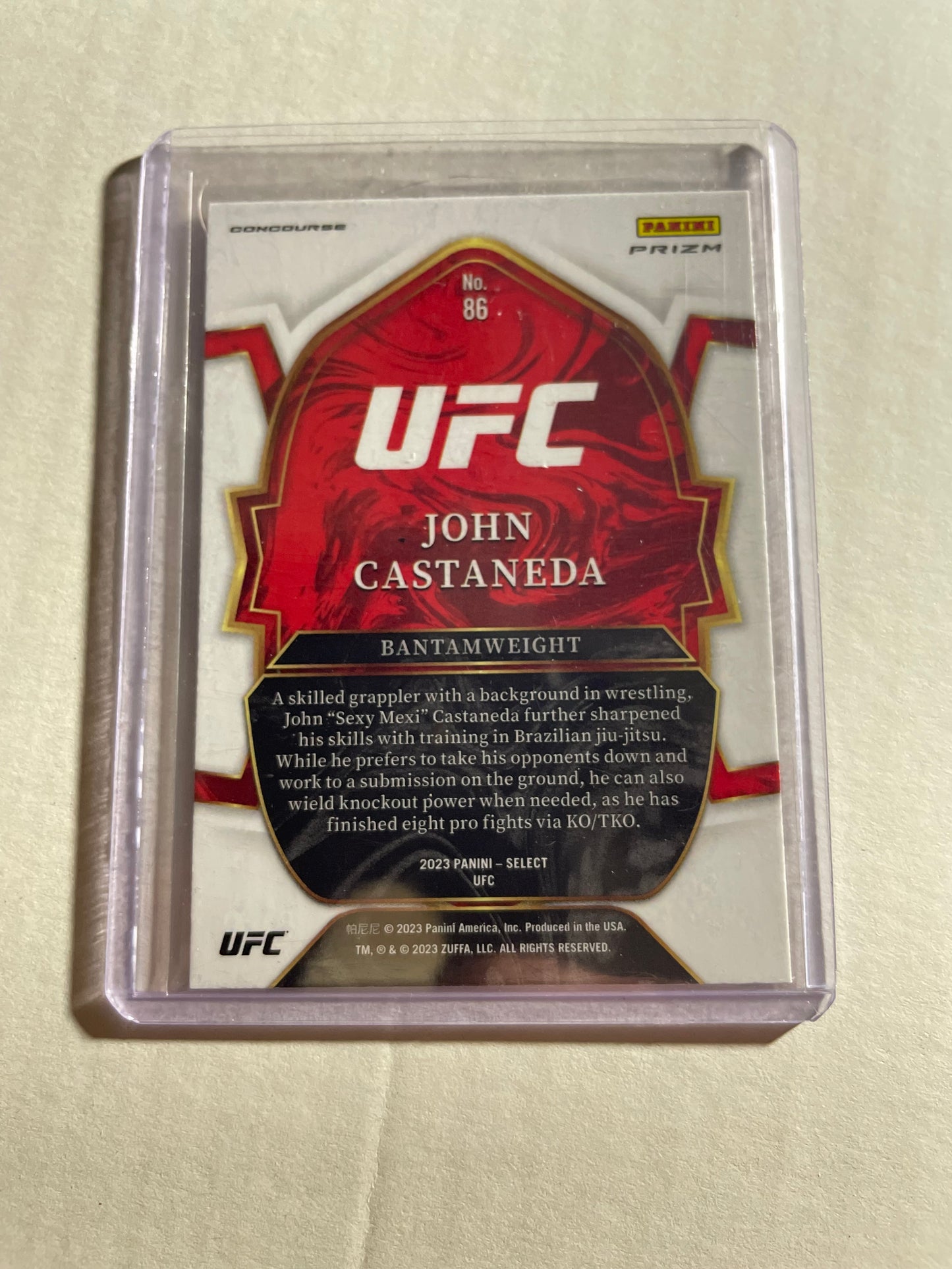 2023 Panini Select UFC trading card featuring fighter John Castaneda.