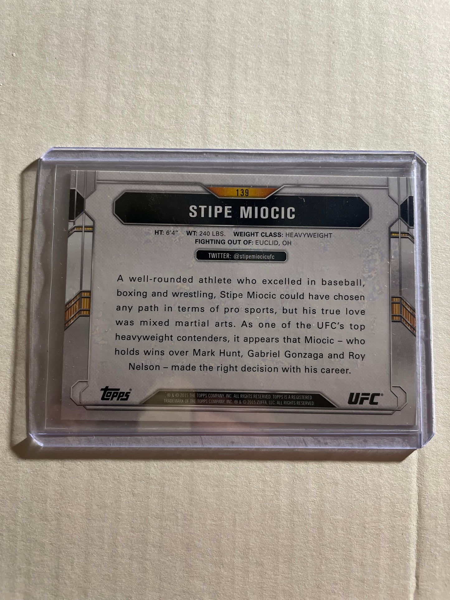 2015 Topps UFC Chronicles trading card former UFC Heavyweight Champion Stipe Miocic.The card, specifically card #139, is part of a set and have green parallel variations