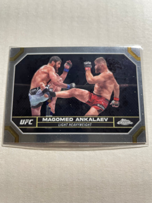 2024 Topps Chrome UFC #118 Magomed Ankalaev base card.It features a chrome finish with a distinct black, silver, and gold border design.