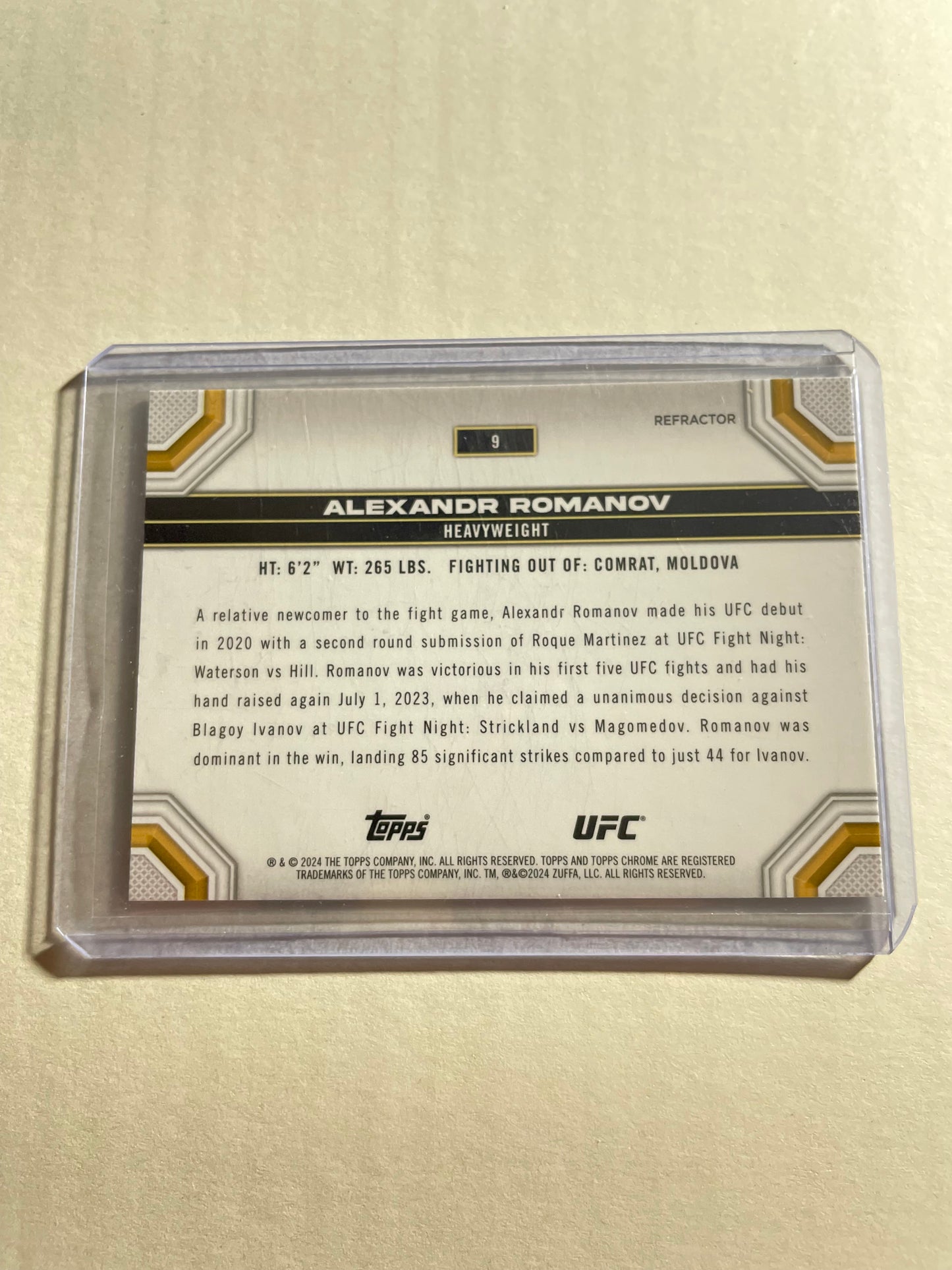 2024 Topps Chrome UFC #9 Alexandr Romanov trading card, specifically a refractor parallel