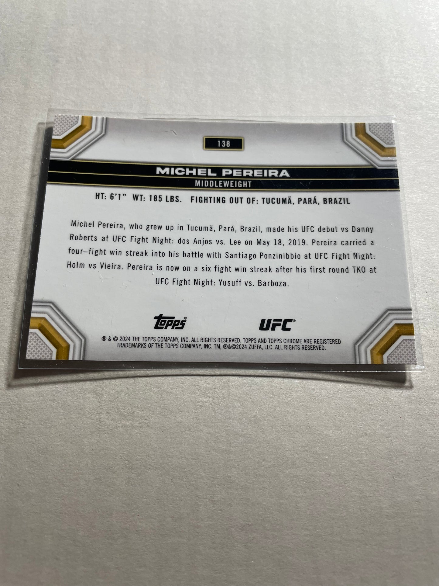 2024 Topps Chrome UFC #138 Michel Pereira base card.It features a chrome finish with a holographic sheen.
