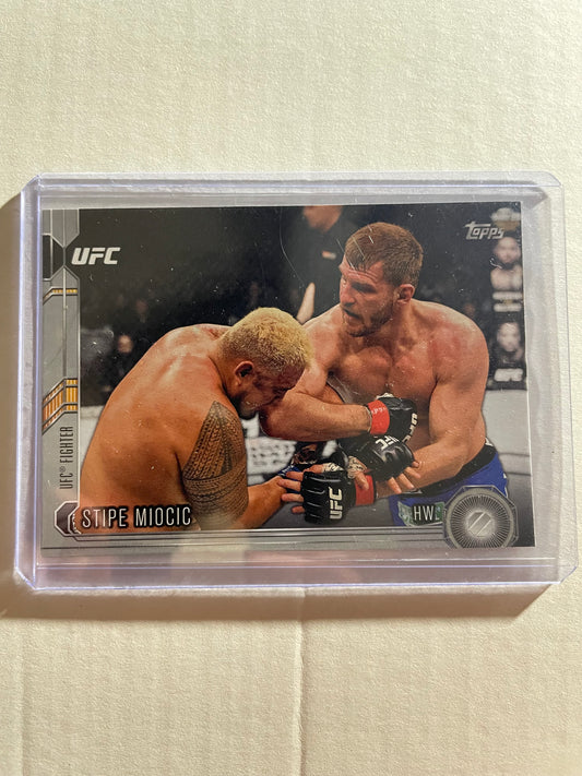 2015 Topps UFC Chronicles trading card former UFC Heavyweight Champion Stipe Miocic.The card, specifically card #139, is part of a set and have green parallel variations