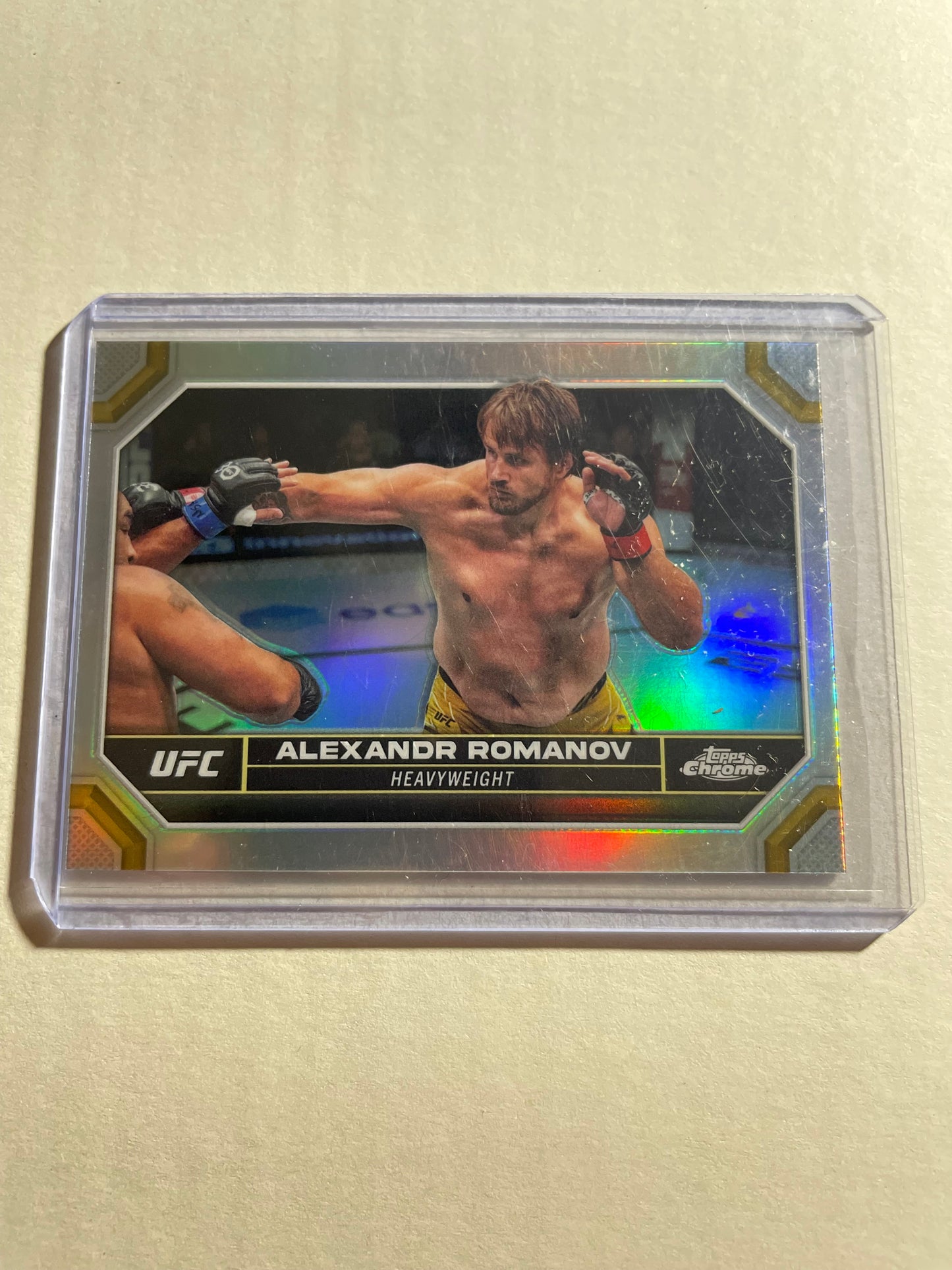 2024 Topps Chrome UFC #9 Alexandr Romanov trading card, specifically a refractor parallel