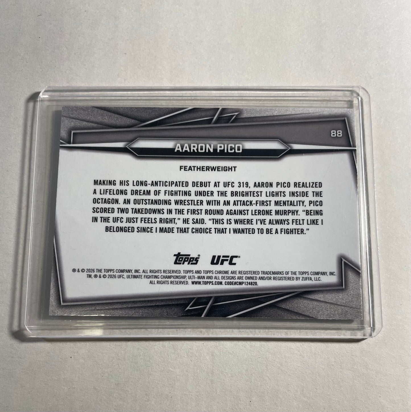 2026 Topps Chrome UFC Aaron Pico Rookie Card, specifically featuring a blue geometric refractor parallel.The card is numbered 007/99, indicating it is a limited edition parallel.