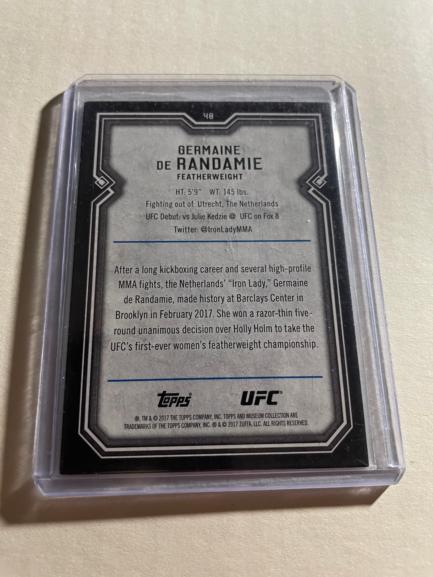 2017 Topps Museum Collection Germaine de Randamie UFC card features a photograph of the fighter celebrating with a French flag