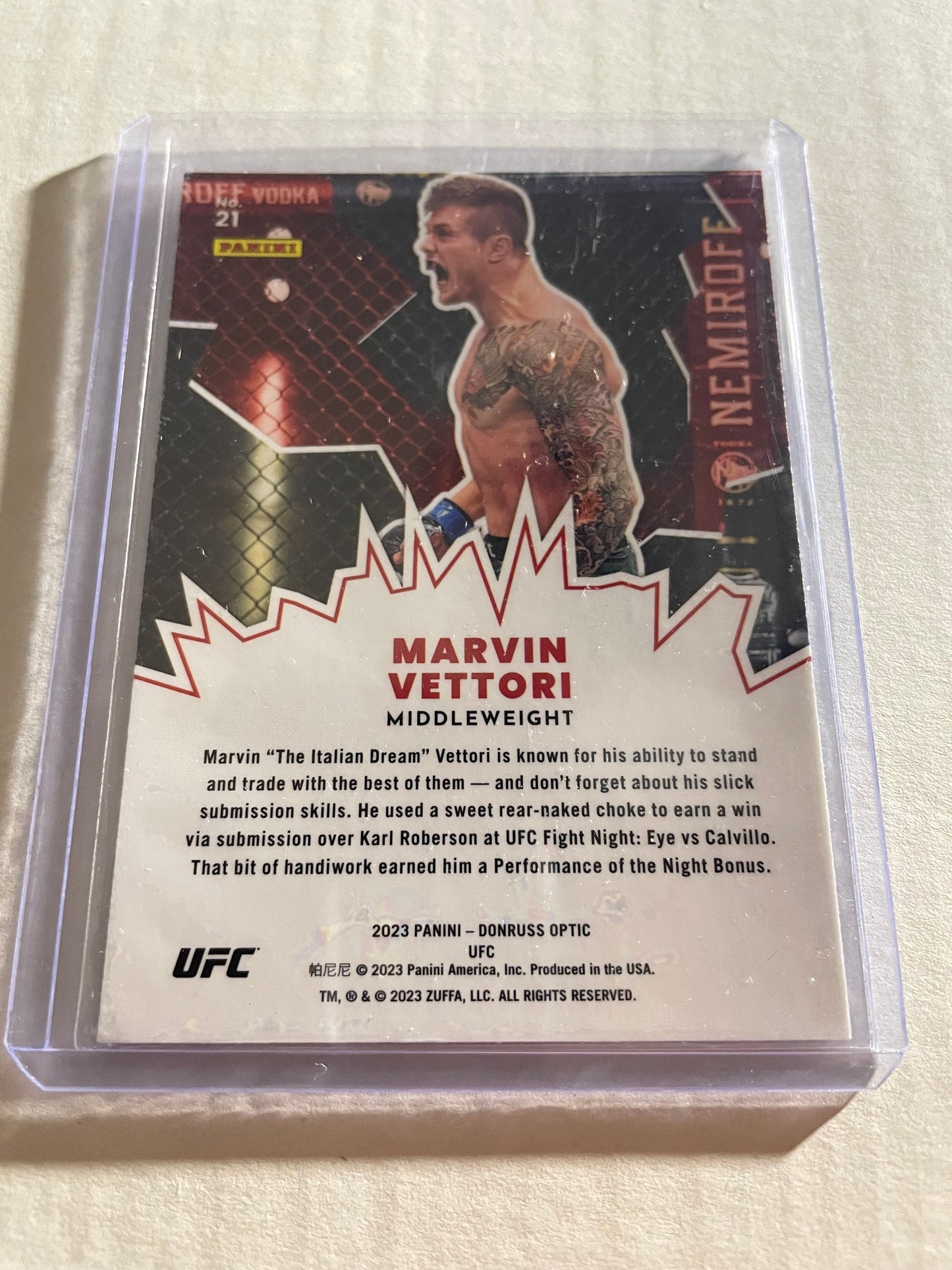2023 Panini Donruss Optic UFC #21 Marvin Vettori "My House" trading card.It features a red cracked ice parallel design