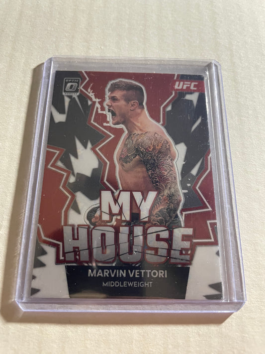 2023 Panini Donruss Optic UFC #21 Marvin Vettori "My House" trading card.It features a red cracked ice parallel design