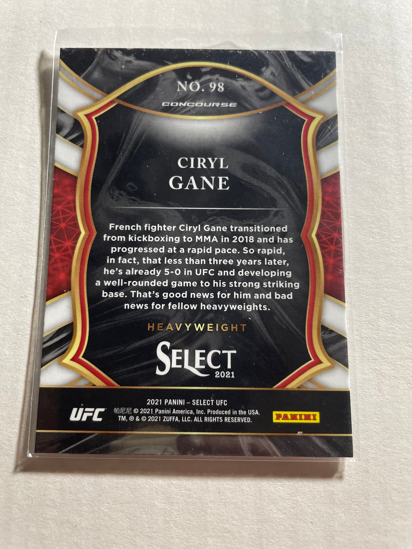 2021 Panini Select Ciryl Gane Concourse rookie card, identified as card number 98.It features Gane during a fight and includes the official "RC" rookie card shield in the upper right corner.