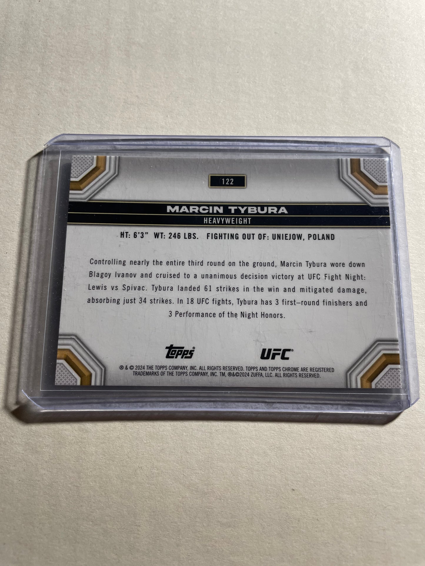 2024 Topps Chrome UFC card featuring fighter Marcin Tybura.The card is identified as the "Prism Lazer Refractor" parallel version of base card #122.